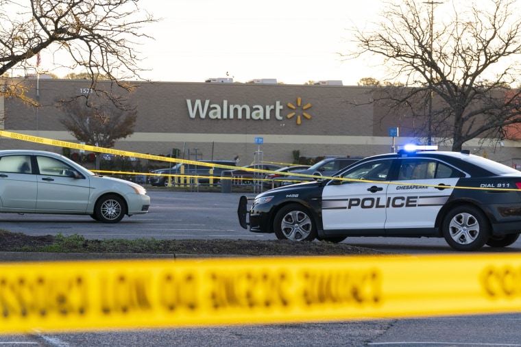 Law enforcement work the scene of a mass shooting at a Walmart, in Chesapeake, Va., on Nov. 23, 2022.  